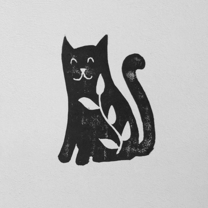 A print of a cat with a plant inside
