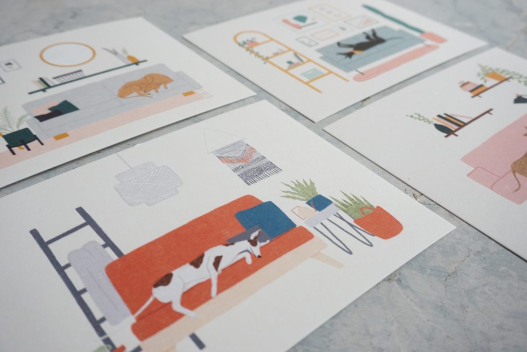 A close up image of art prints featuring greyhound illustrations