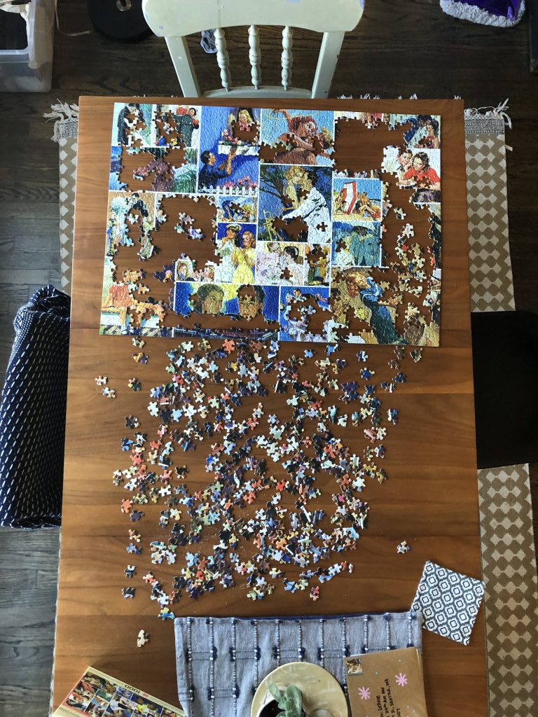 A puzzle in progress on a dining room table