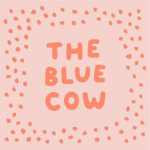 The Blue Cow in pink with little dots all around the border