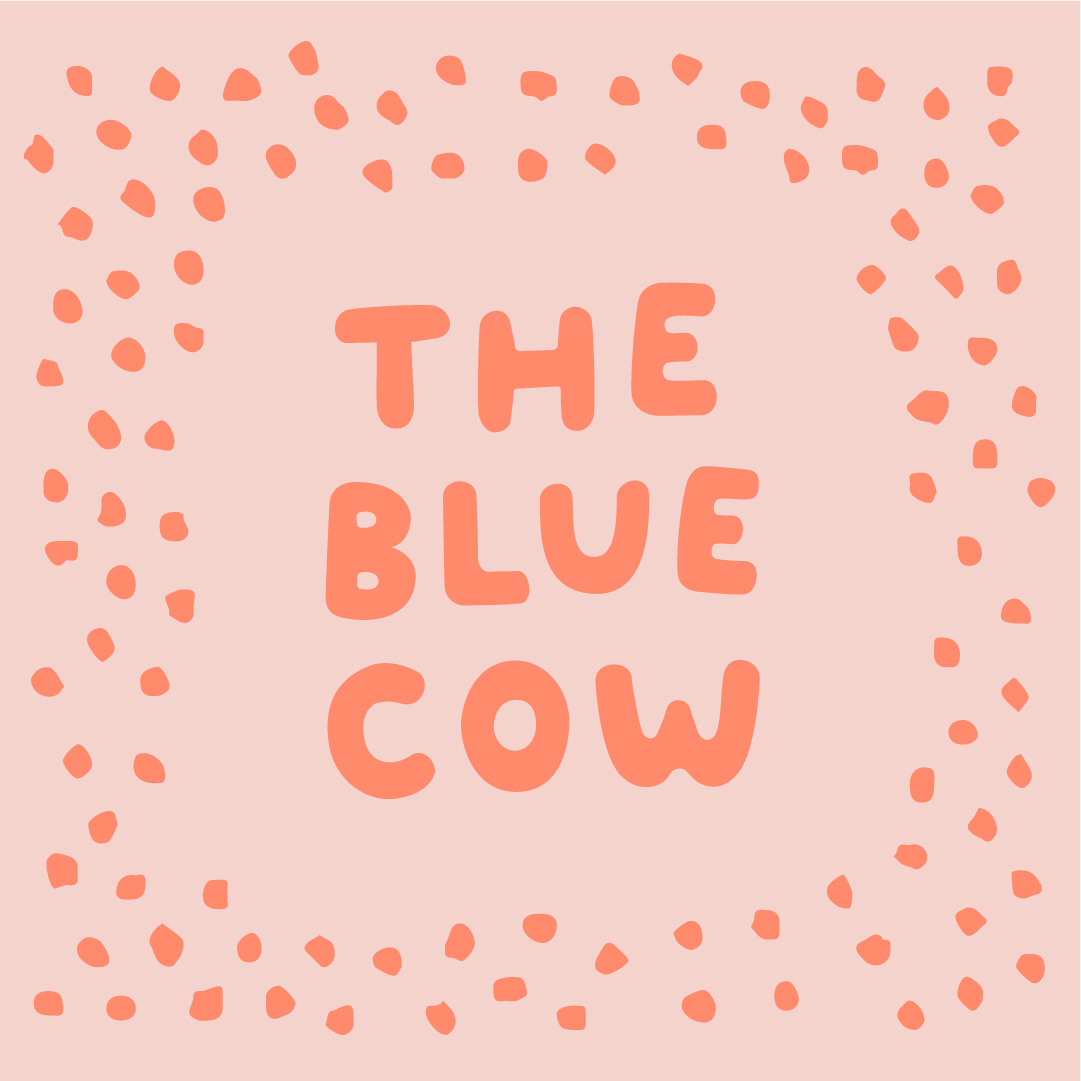 The Blue Cow in pink with little dots all around the border