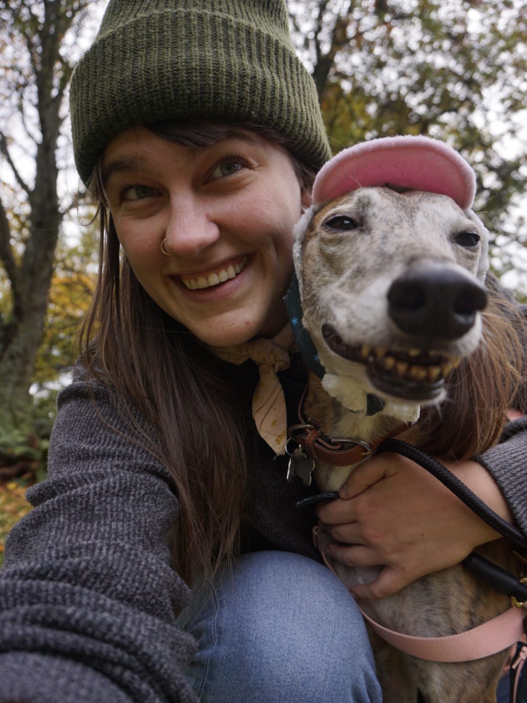 Kaila hugs Greer close, both are smiling and wearing hats